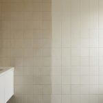 Before and after transformation of dated ceramic bathroom tile painted in a fresh modern finish.