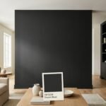 Sherwin-Williams Tricorn Black SW 6258 shown as a near-true black paint color on a sophisticated living room wall with a matching paint sample in natural daylight.